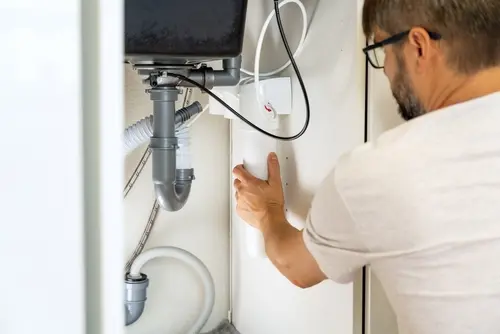 Technician performing water treatment maintenance in Broward, FL ensuring reliable system upkeep and long-term water filtration performance
