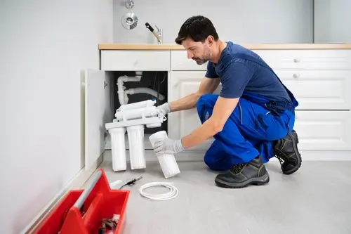 Experienced installer performing water filtration system installation in Broward, FL to ensure proper setup and improved water quality