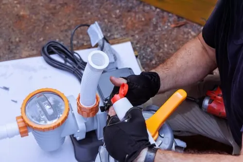 Technician performing well pump repair in Broward, FL to restore water pressure and ensure reliable well system operation for residential and commercial properties