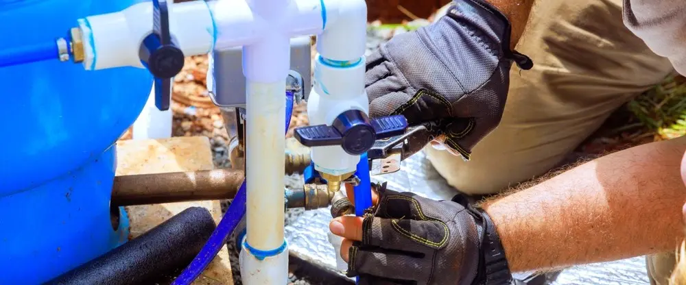 Technicians repairing a well pump in Broward, FL to restore water flow, improve system performance, and ensure reliable water supply